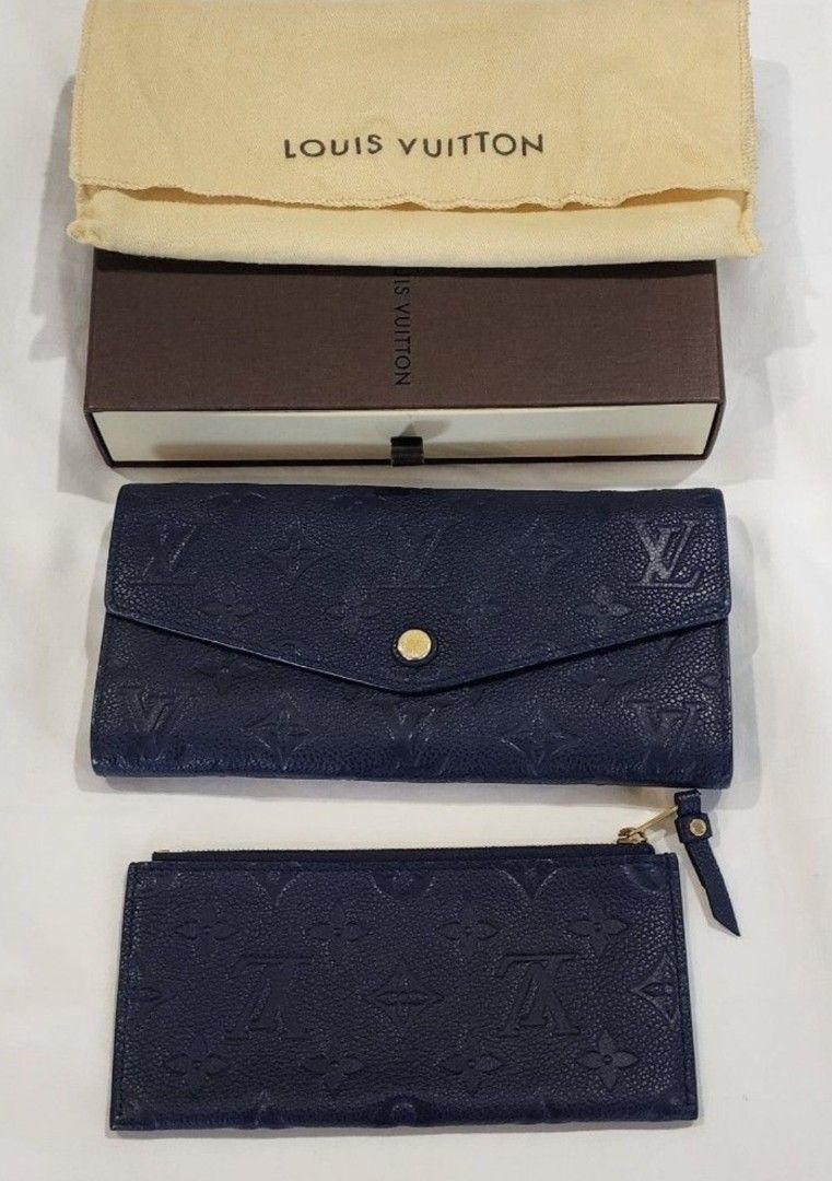 Louis Vuitton Empreinte Long Wallet Navy Blue (Category: Luxury Bags & Wallets) located in Butuan. Submitted by sofiaharmonie (Listing ID 1451492094, Image 1). Description: - Authentic Navy Blue Louis Vuitton Wallet - Monogram Empreinte Leather - Made in Spain - Includes separate card holder pouch - Snap button closure - Plenty of card slots - Comes with original box and dust bag - excellent condition.