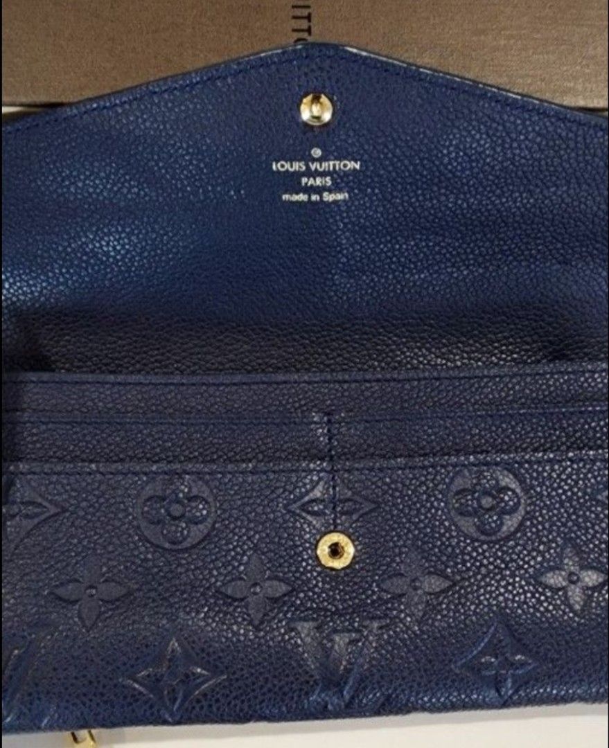 Louis Vuitton Empreinte Long Wallet Navy Blue (Category: Luxury Bags & Wallets) located in Butuan. Submitted by sofiaharmonie (Listing ID 1451492094, Image 2). Description: - Authentic Navy Blue Louis Vuitton Wallet - Monogram Empreinte Leather - Made in Spain - Includes separate card holder pouch - Snap button closure - Plenty of card slots - Comes with original box and dust bag - excellent condition.