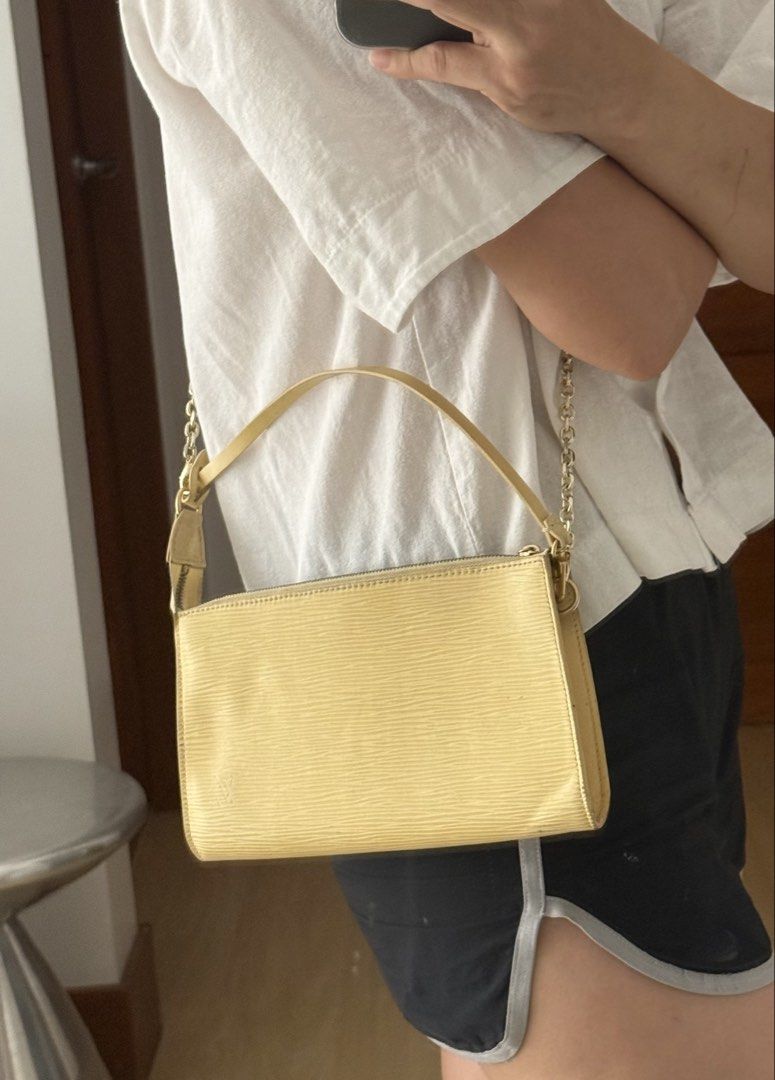Louis Vuitton Epi Pochette Accessoire Yellow (Category: Luxury Bags & Wallets) located in Taguig. Submitted by milchlee (Listing ID 1451355938, Image 1). Description: - Authentic Yellow Louis Vuitton Epi Pochette Accessoire - Classic and timeless design - Features a chic gold chain strap - Secure zipper closure - Compact size, ideal for carrying essentials - Versatile: can be styled as a shoulder bag or a clutch.