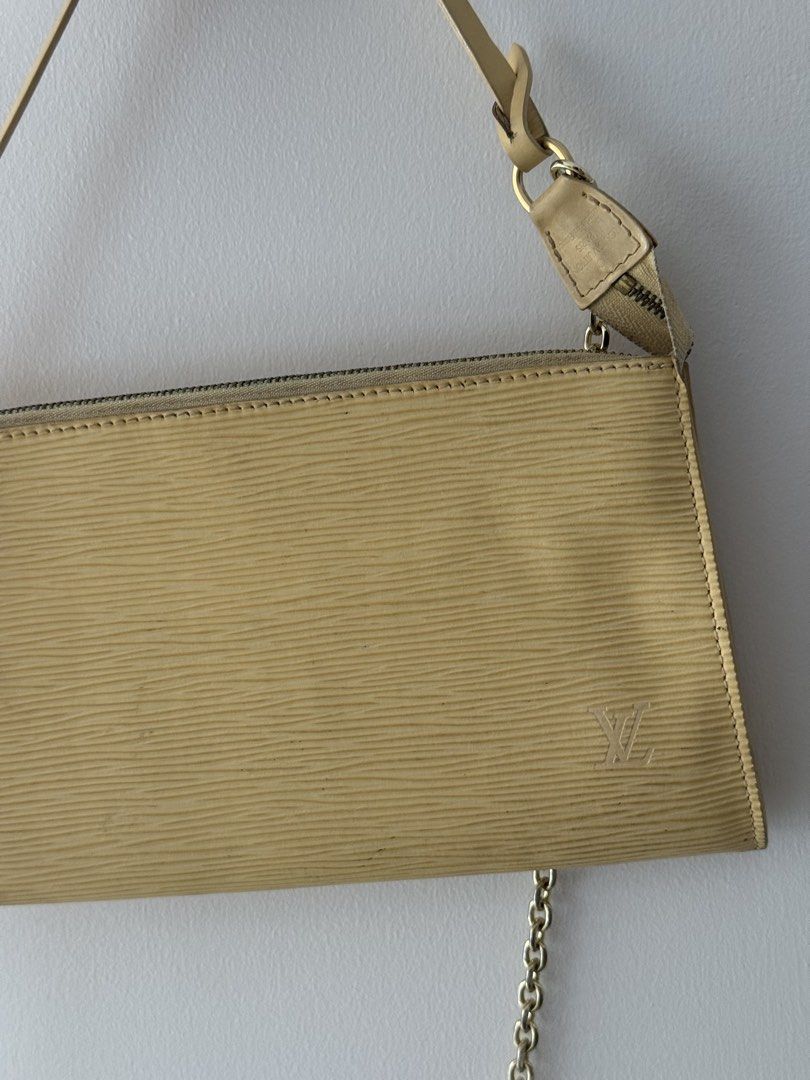 Louis Vuitton Epi Pochette Accessoire Yellow (Category: Luxury Bags & Wallets) located in Taguig. Submitted by milchlee (Listing ID 1451355938, Image 3). Description: - Authentic Yellow Louis Vuitton Epi Pochette Accessoire - Classic and timeless design - Features a chic gold chain strap - Secure zipper closure - Compact size, ideal for carrying essentials - Versatile: can be styled as a shoulder bag or a clutch.