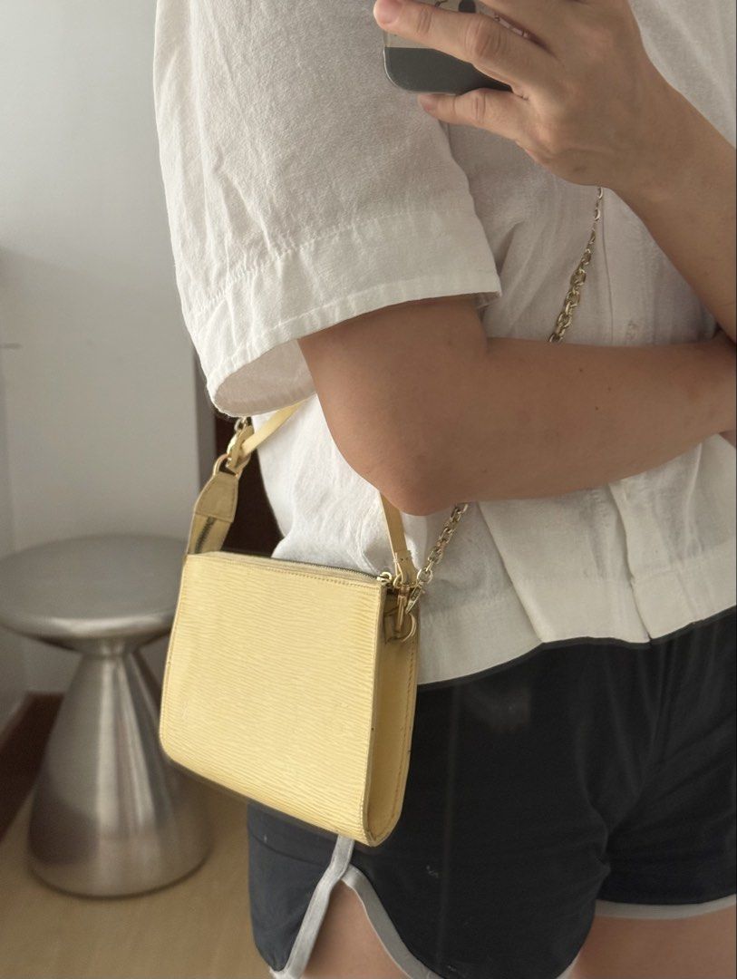Louis Vuitton Epi Pochette Accessoire Yellow (Category: Luxury Bags & Wallets) located in Taguig. Submitted by milchlee (Listing ID 1451355938, Image 2). Description: - Authentic Yellow Louis Vuitton Epi Pochette Accessoire - Classic and timeless design - Features a chic gold chain strap - Secure zipper closure - Compact size, ideal for carrying essentials - Versatile: can be styled as a shoulder bag or a clutch.