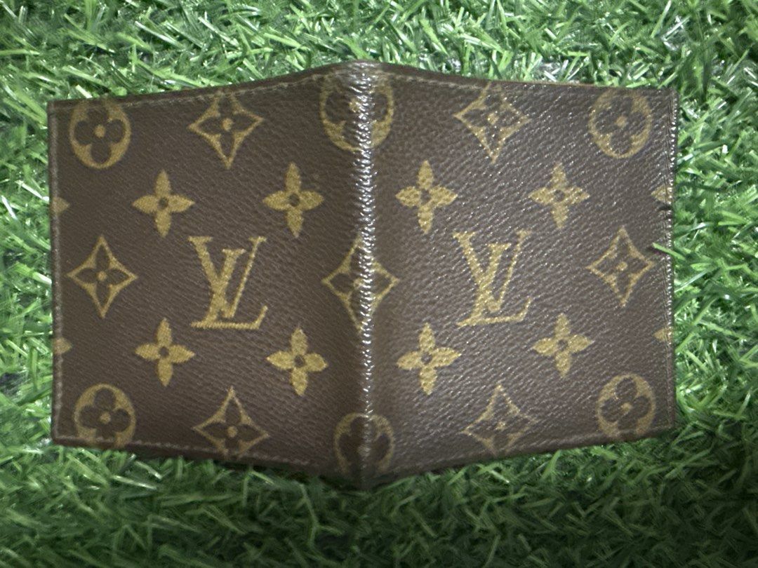 Louis Vuitton Monogram Bifold Wallet (Category: Luxury Bags & Wallets) located in Marilao. Submitted by its_me_bolinoy (Listing ID 1451330925, Image 3). Description: - Authentic Louis Vuitton monogram bifold wallet - Classic brown canvas with iconic LV pattern - Multiple card slots and compartments inside - Shows some signs of wear on edges and interior (consistent with regular use) - A timeless and essential accessory.