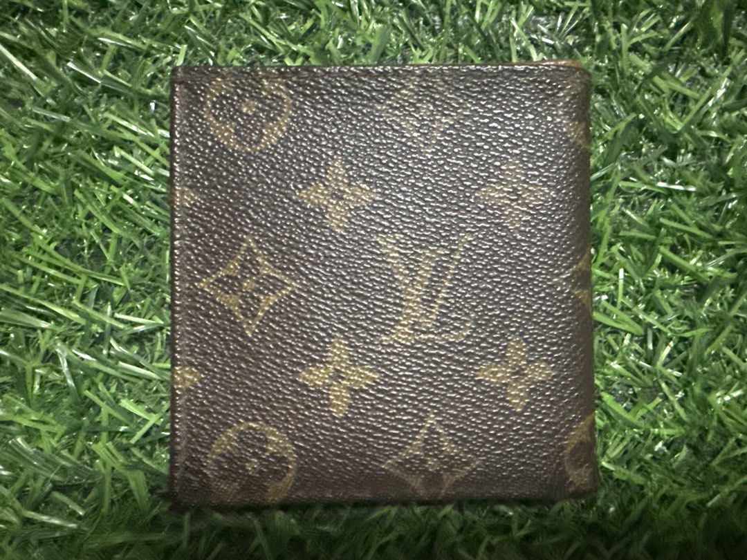 Louis Vuitton Monogram Bifold Wallet (Category: Luxury Bags & Wallets) located in Marilao. Submitted by its_me_bolinoy (Listing ID 1451330925, Image 2). Description: - Authentic Louis Vuitton monogram bifold wallet - Classic brown canvas with iconic LV pattern - Multiple card slots and compartments inside - Shows some signs of wear on edges and interior (consistent with regular use) - A timeless and essential accessory.