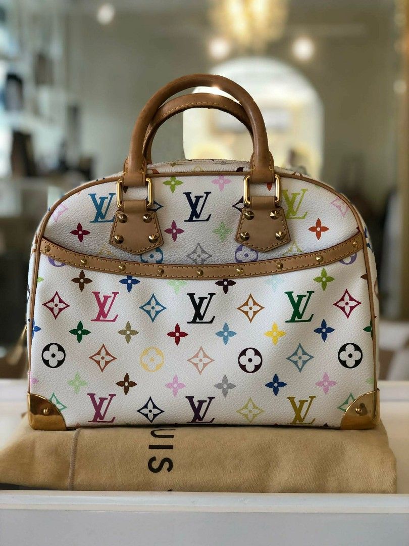 Louis Vuitton Monogram Multicolore Trouville (Category: Luxury Bags & Wallets) located in Manila. Submitted by quickmoon_a9283f (Listing ID 1451412412, Image 1). Description: - Authentic Louis Vuitton Trouville - Monogram Multicolore white canvas with colorful LV print - Leather handles and trim - Gold hardware - Classic design, ideal for everyday or travel - Comes with dust bag.