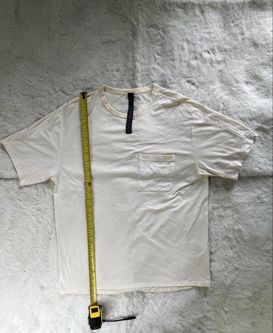 LULULEMON - Cream Pocket T-Shirt (Category: Tshirts & Polo Shirts ) located in Naga. Submitted by fresh_fit (Listing ID 1451471568, Image 1). Description: LULULEMON - Cream Pocket T-Shirt - Cream colored t-shirt - Features a chest pocket - Short sleeves and crew neck - Simple, classic design - Comfortable for everyday casual wear - Measurements available in the first photo Size: M on tag (can fit Medium to Large) Width: 21 inches Length: 27 inche