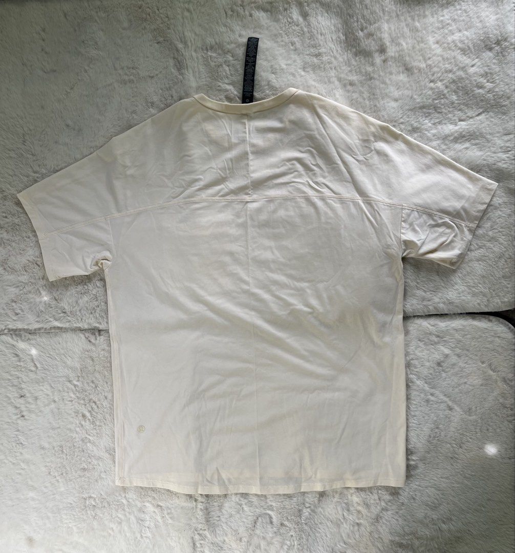 LULULEMON - Cream Pocket T-Shirt (Category: Tshirts & Polo Shirts ) located in Naga. Submitted by fresh_fit (Listing ID 1451471568, Image 2). Description: LULULEMON - Cream Pocket T-Shirt - Cream colored t-shirt - Features a chest pocket - Short sleeves and crew neck - Simple, classic design - Comfortable for everyday casual wear - Measurements available in the first photo Size: M on tag (can fit Medium to Large) Width: 21 inches Length: 27 inche
