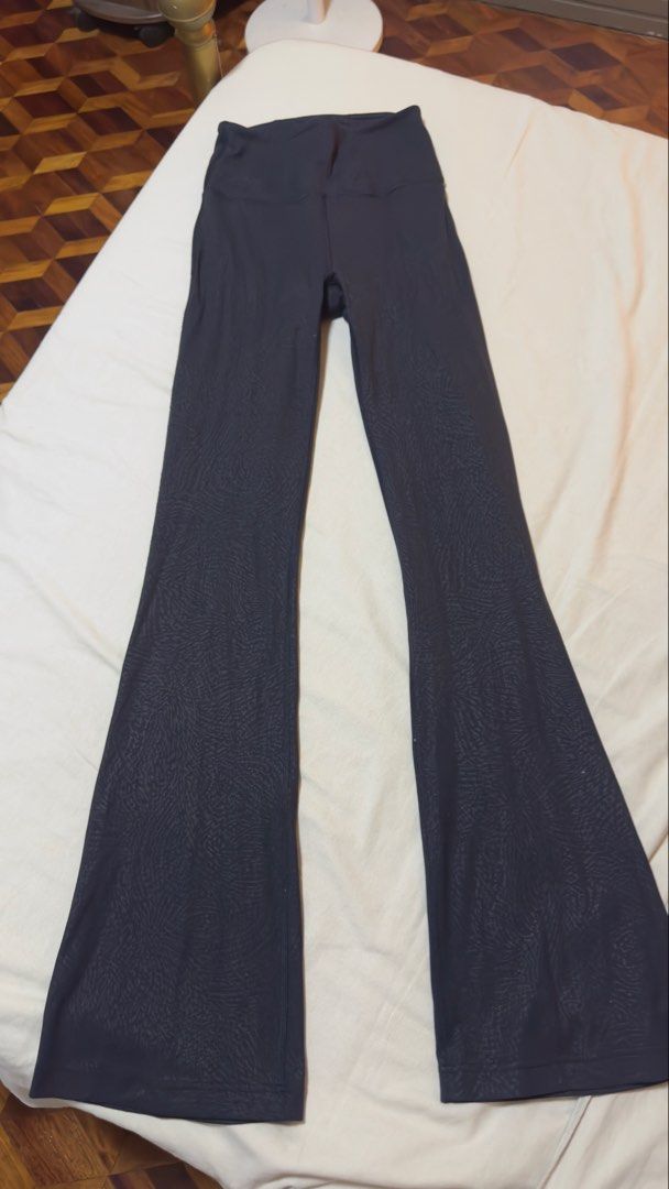 Lululemon Align High-Rise Flare Leggings Black Pattern Size 4 (Category: Activewear) located in Las Pinas. Submitted by mbisl (Listing ID 1451476763, Image 2). Description: Lululemon Align leggings in a black textured pattern. High-rise waist with a flare leg opening. Comfortable and stretchy material. Great for workouts or casual wear. Size 4. Check photos for details..