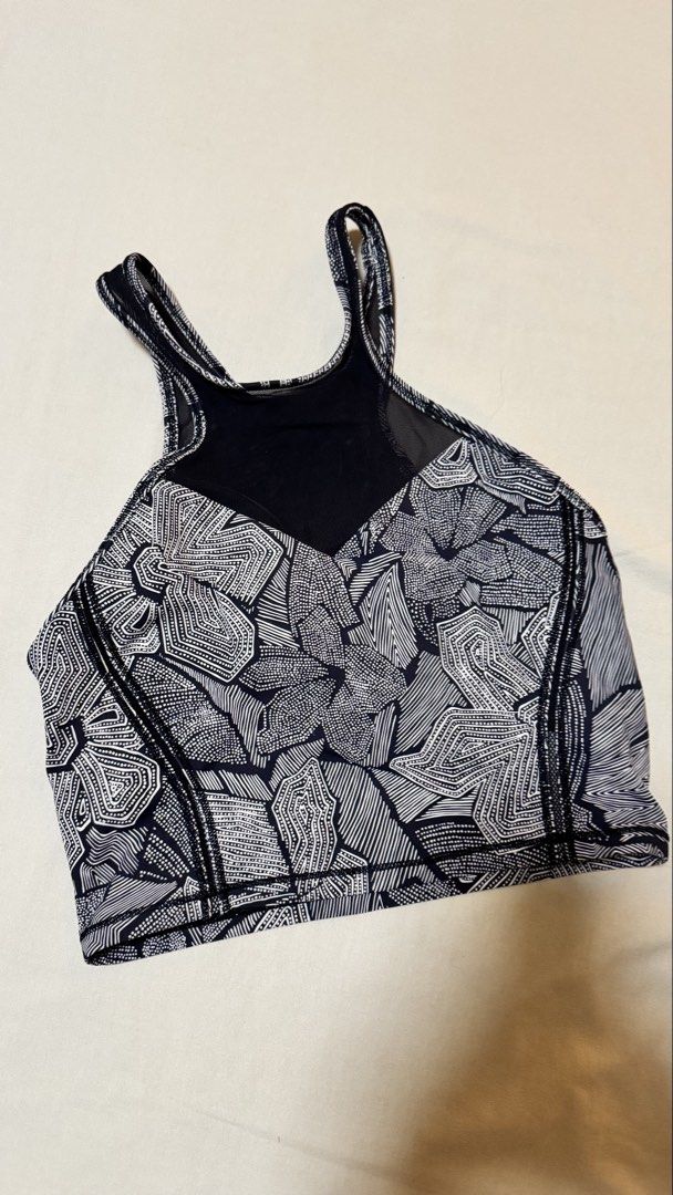 Lululemon Sports Bra Size 4 (Category: Activewear) located in Las Pinas. Submitted by mbisl (Listing ID 1451476292, Image 1). Description: - Lululemon sports bra - Stylish black and white geometric print - Mesh panel at the back for enhanced breathability - Comfortable and supportive straps - Features the Lululemon logo on the back - Perfect for workouts or layering.