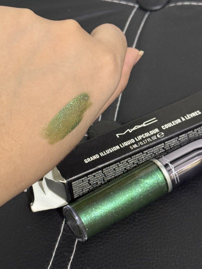 MAC Grand Illusion Liquid Lipcolour - Peace, Love, Unity, Respect (Category: Makeup) located in Manila. Submitted by mesii.18 (Listing ID 1451489662, Image 2). Description: - MAC Grand Illusion Liquid Lipcolour - Shade: Peace, Love, Unity, Respect - Color: Shimmery metallic green - Finish: Metallic - Packaging: Comes in original box - Benefit: Adds sparkle and a unique touch to your makeup look.