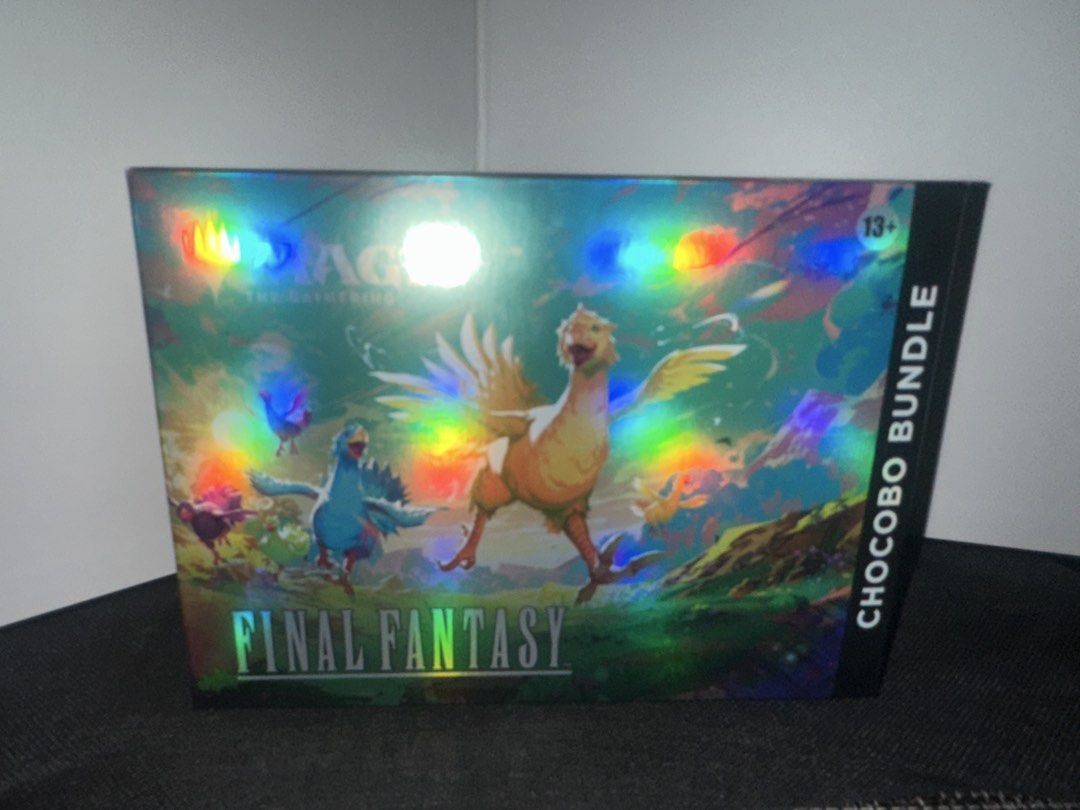 Magic The Gathering Final Fantasy Chocobo Bundle (Category: Card Packs) located in Mandaluyong City. Submitted by alluveon (Listing ID 1451454343, Image 1). Description: Sealed English Version Calling all chocobo fans! Celebrate your fleet-footed, feathered friends with this charming bundle, featuring Full-Art Chocobo Basics, an exclusive promo card, a chocobo-themed Click Wheel life counter, plus a whole nest of Magic: The Gathering—FINAL FANTAS