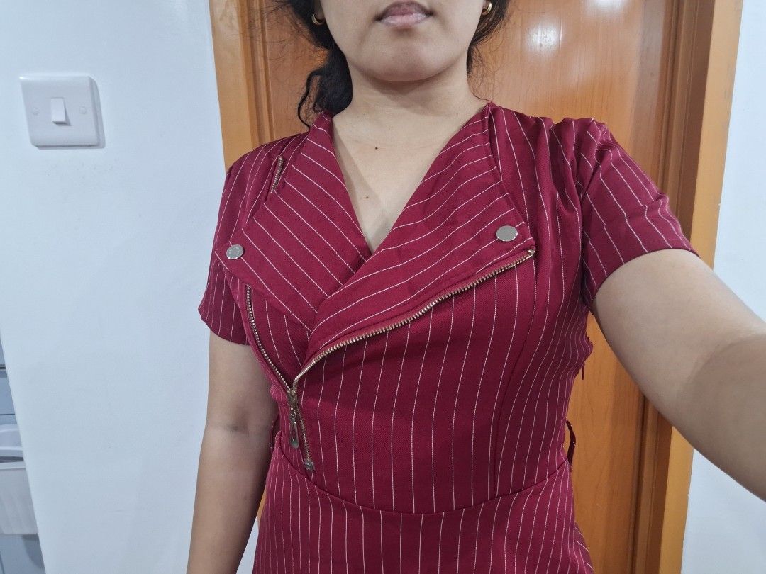 Maroon Striped Zipper Dress (Category: Dresses) located in Antipolo. Submitted by blueverly (Listing ID 1451485924, Image 3). Description: - Fits medium size - Stylish maroon dress with subtle white pinstripes. - Unique asymmetrical zipper detail on the front. - Flattering belted waist. - Knee-length skirt. - Ideal for both casual outings and work attire..