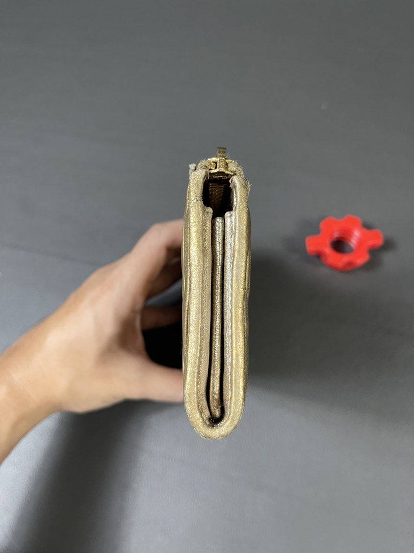 Miu Miu Matelassé Zip-Around Long Wallet (Category: Luxury Bags & Wallets) located in Caloocan City. Submitted by dapreluv (Listing ID 1451436418, Image 3). Description: Miu Miu Matelassé Zip-Around Long Wallet. Brand: Miu Miu Model: Matelassé Zip Around Long Wallet Material: Matelassé (ruched/pleated) lambskin nappa leather Color: Metallic Gold / Bronze Gold Hardware: Gold-tone Era: Approximately 2008–2012 .