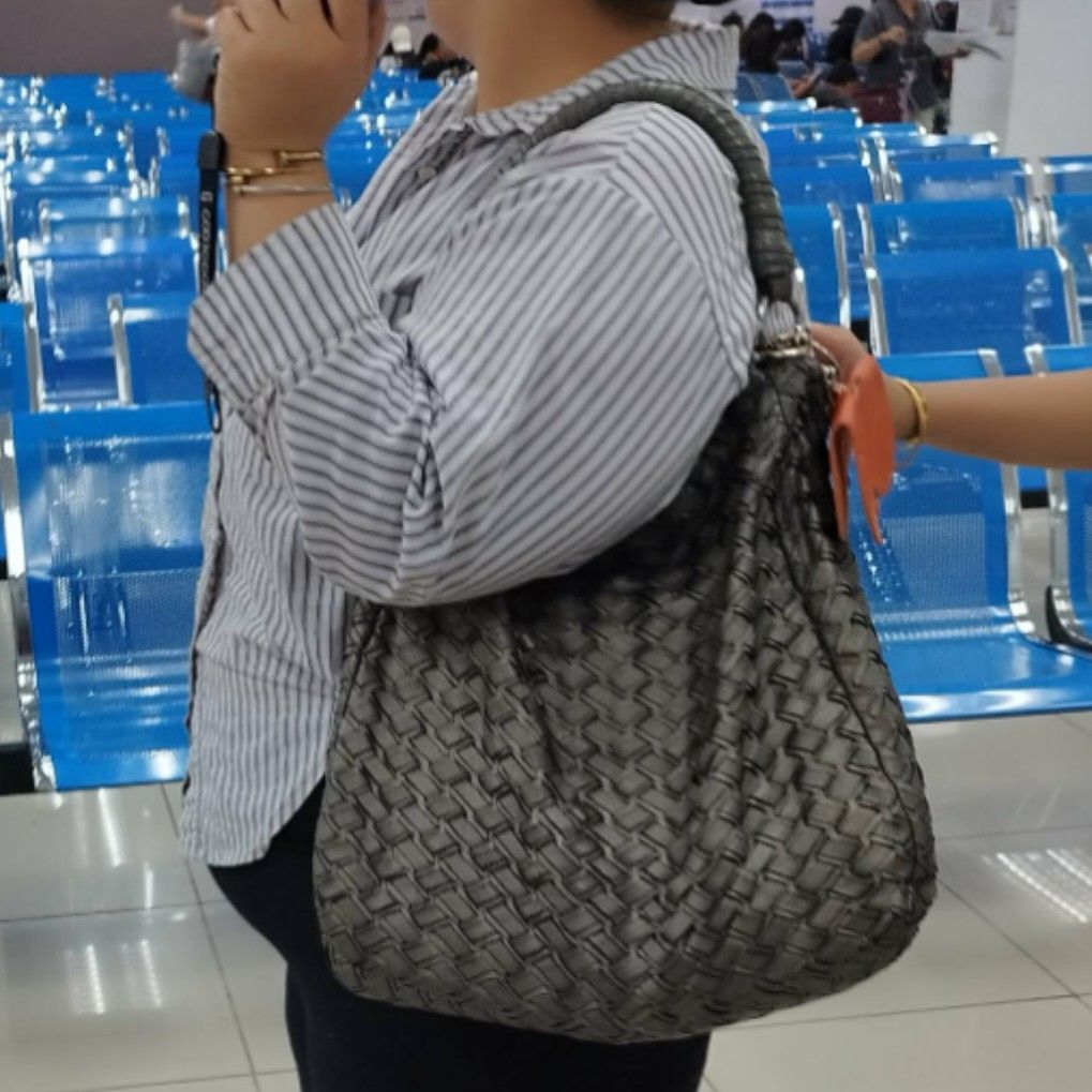 Miu Miu Woven Leather Hobo Bag (Category: Luxury Bags & Wallets) located in Quezon City. Submitted by cloudymay (Listing ID 1451154066, Image 2). Description: - Grey woven leather hobo bag - Features Miu Miu logo on metal plate - Braided leather handles - Silver hardware - Dark satin interior lining - Stylish and unique accessory -normal signs of use. has minor flaw that can be glued unnoticed. - Has certificate of authenticity from the prelove s