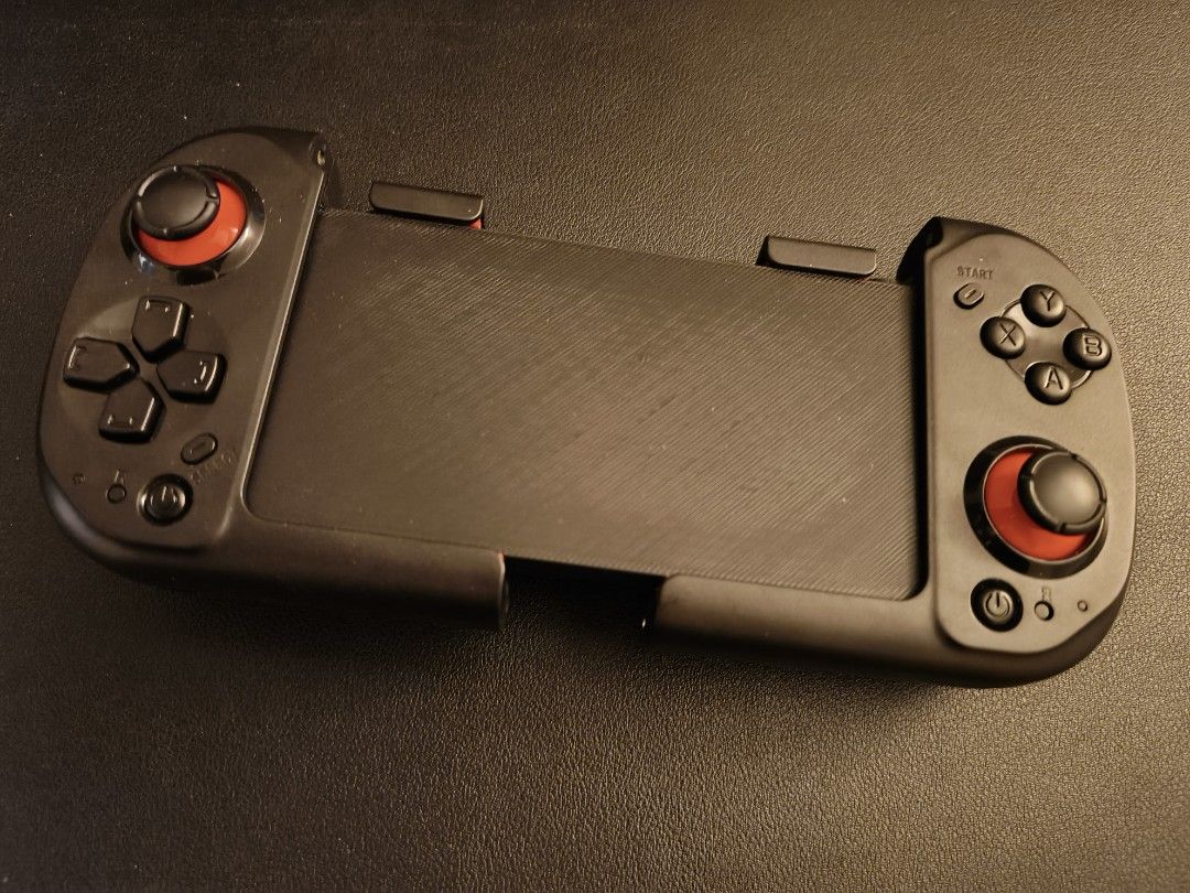 Mocute Bluetooth controller (Category: Controllers) located in Bukit Mertajam. Submitted by whynottt_ (Listing ID 1451459855, Image 3). Description: like new all in good condition special 3D print for joycon grip can connect with phone and pc.