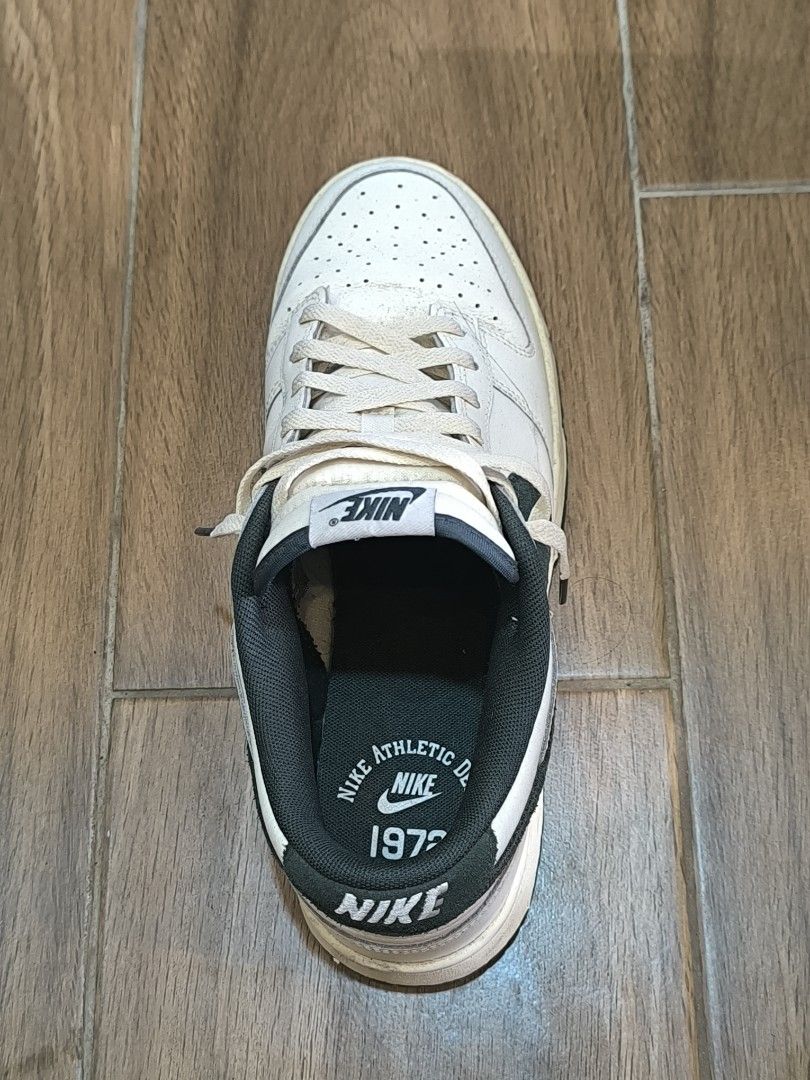 Nike Dunk Low White Black 1972 Athletic Dept. (Category: Sneakers) located in Manila. Submitted by tippytottie (Listing ID 1451420829, Image 2). Description: - Original - Classic white Nike Dunks - Black swoosh detail - Features 1972 Athletic Dept. logo on insole - Laces are a bit off-white - Soles show some dirt and wear.