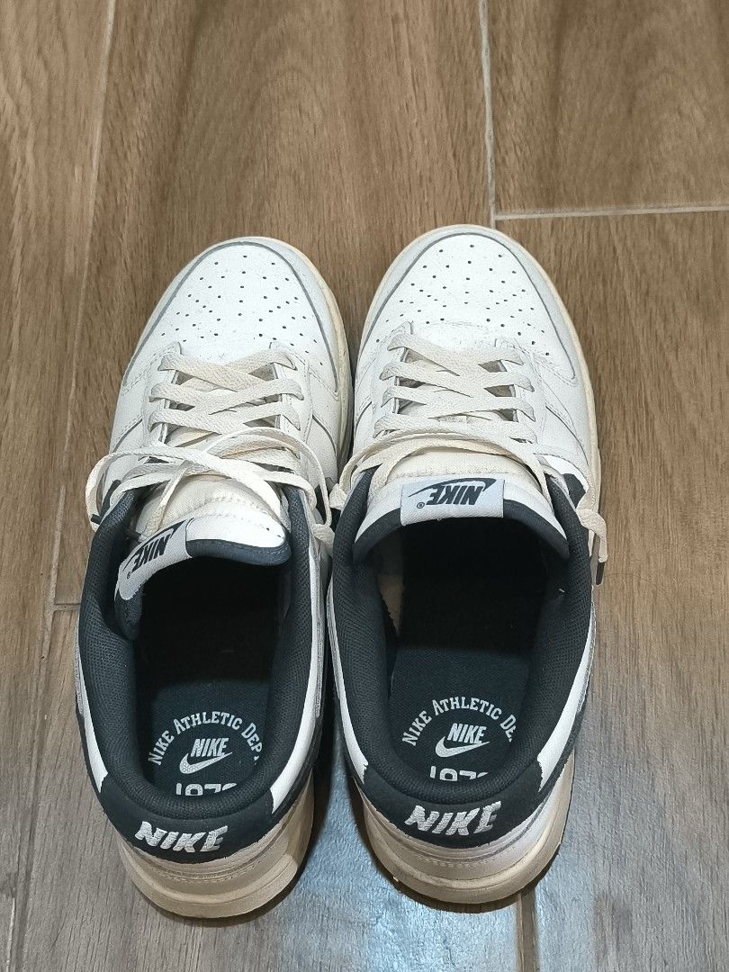 Nike Dunk Low White Black 1972 Athletic Dept. (Category: Sneakers) located in Manila. Submitted by tippytottie (Listing ID 1451420829, Image 3). Description: - Original - Classic white Nike Dunks - Black swoosh detail - Features 1972 Athletic Dept. logo on insole - Laces are a bit off-white - Soles show some dirt and wear.