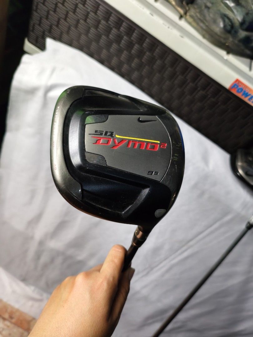 Nike SQ Dymo2 Driver Golf Club (Category: Golf) located in Manila. Submitted by meiyeon2 (Listing ID 1451336636, Image 1). Description: - Nike SQ Dymo2 Driver - Yellow shaft with black and yellow graphics - Black grip with yellow accents - Perfect for golfers looking to upgrade.