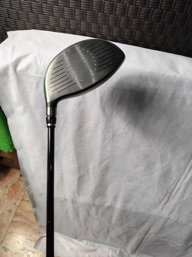 Nike SQ Dymo2 Driver Golf Club (Category: Golf) located in Manila. Submitted by meiyeon2 (Listing ID 1451336636, Image 2). Description: - Nike SQ Dymo2 Driver - Yellow shaft with black and yellow graphics - Black grip with yellow accents - Perfect for golfers looking to upgrade.
