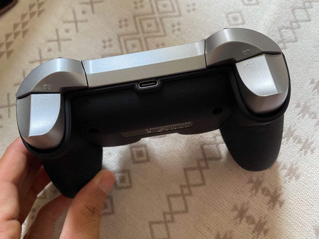 Nintendo switch Controller (Category: Controllers) located in Singapore. Submitted by yukiwaru007 (Listing ID 1451431422, Image 3). Description: - Nintendo switch Controller from amazon - Color: Black & Silver - Features: Dual analog sticks, D-pad, face buttons, shoulder buttons, and triggers - Charging: USB-C (top port) - Condition: Excellent, fully functional, no known issues Will dispatch the item in 2 working days. Price include mailing fee. 