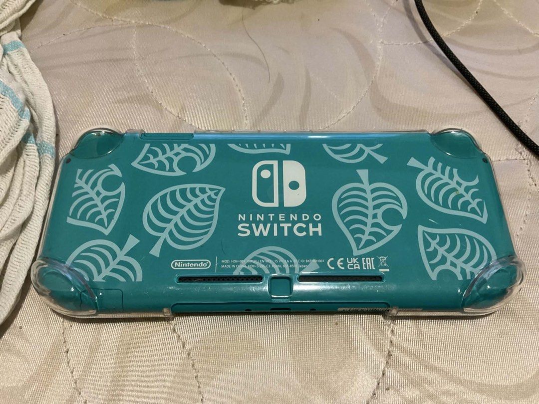Nintendo Switch Lite Turquoise Animal Crossing Edition (Category: Nintendo) located in Manila. Submitted by cosmicshark.a27f1b (Listing ID 1451337008, Image 2). Description: Turquoise Nintendo Switch Lite Animal Crossing Edition with leaf design Comes with a clear protective case Original Price: P9,950 Reason for Selling: Need urgent funds for personal emergency Condition: Only used it for a month, still like new, slight crack in tempered glass o