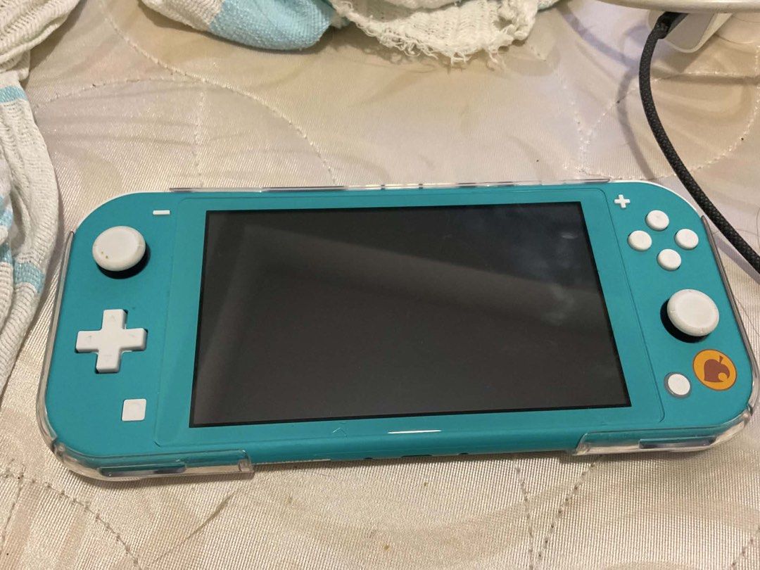 Nintendo Switch Lite Turquoise Animal Crossing Edition (Category: Nintendo) located in Manila. Submitted by cosmicshark.a27f1b (Listing ID 1451337008, Image 1). Description: Turquoise Nintendo Switch Lite Animal Crossing Edition with leaf design Comes with a clear protective case Original Price: P9,950 Reason for Selling: Need urgent funds for personal emergency Condition: Only used it for a month, still like new, slight crack in tempered glass o