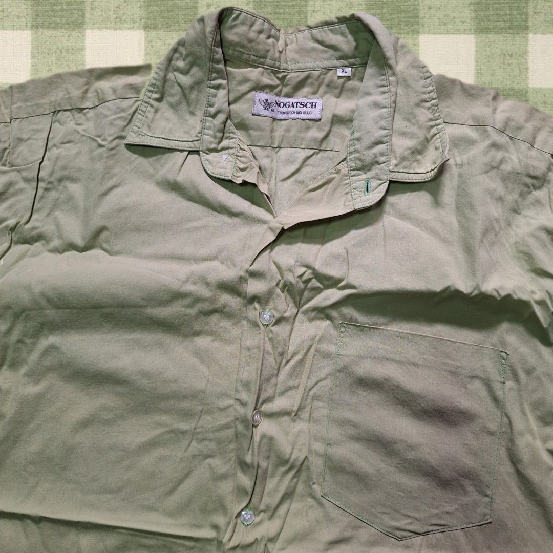 NOGATSCH Short Sleeve Button Up Shirt (Category: Tshirts & Polo Shirts ) located in Rizal. Submitted by caramelmics (Listing ID 1443808842, Image 2). Description: Light green short sleeve shirt Size: XL NO ISSUE DM me for questions! MOP: GCash or Maribank MOD: J&T Tags: green shirt, short sleeve shirt, light green top, casual shirt, plain shirt, size XL shirt, unisex shirt, basic shirt, preloved shirt.