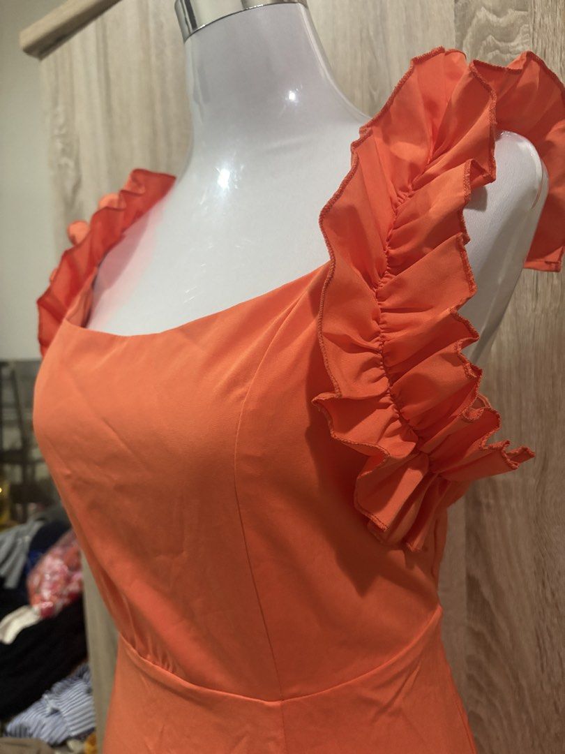 Orange Square Neck Ruffle Sleeve Midi Dress (Category: Dresses) located in Manila. Submitted by roseannn_ (Listing ID 1451453308, Image 2). Description: - Orange midi dress - Square neckline - Cute ruffle sleeve details - Smooth fabric with nice drape - Simple and chic for any occasion - Versatile: dress up or down - Large - mid to big size.
