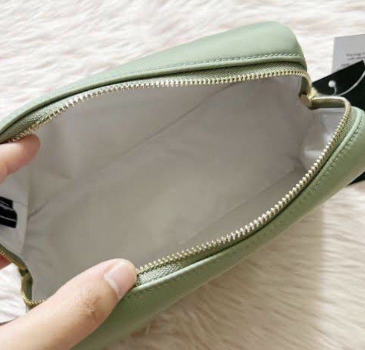 💯original kate spade♠️ pouch light green (Category: Luxury Bags & Wallets) located in Santa Ana. Submitted by palmajanic53308 (Listing ID 1451462274, Image 3). Description: sale!!! sale!!! sale!! 💯original sealed and brandnew with paper bag i have 2pcs stock fresh from US .