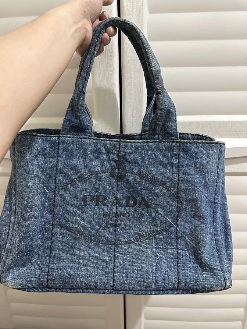 Original Prada Denim Tote Bag (Category: Luxury Bags & Wallets) located in Naga. Submitted by bag.net (Listing ID 1451473599, Image 1). Description: - Authentic Prada denim tote bag( Guaranteed original 💯 moneyback) - Classic design with iconic Prada logo - Spacious interior for essentials - Perfect for everyday use - Shows some minor signs of wear consistent with age but still stunning in actual.