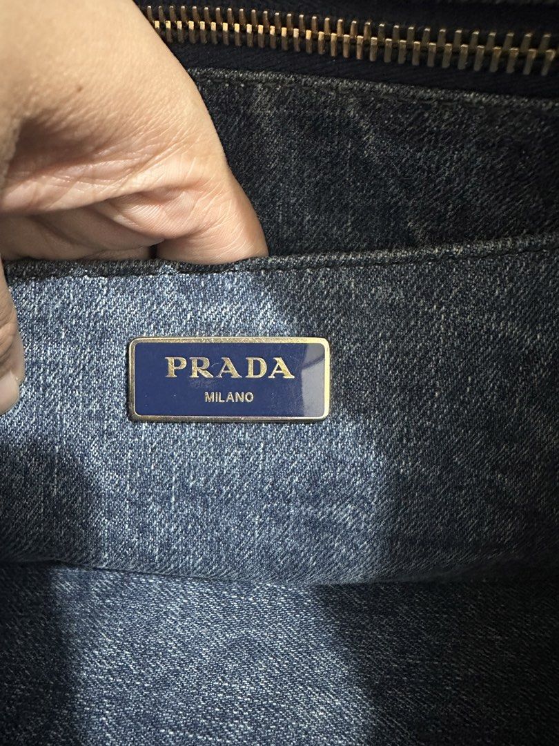 Original Prada Denim Tote Bag (Category: Luxury Bags & Wallets) located in Naga. Submitted by bag.net (Listing ID 1451473599, Image 3). Description: - Authentic Prada denim tote bag( Guaranteed original 💯 moneyback) - Classic design with iconic Prada logo - Spacious interior for essentials - Perfect for everyday use - Shows some minor signs of wear consistent with age but still stunning in actual.