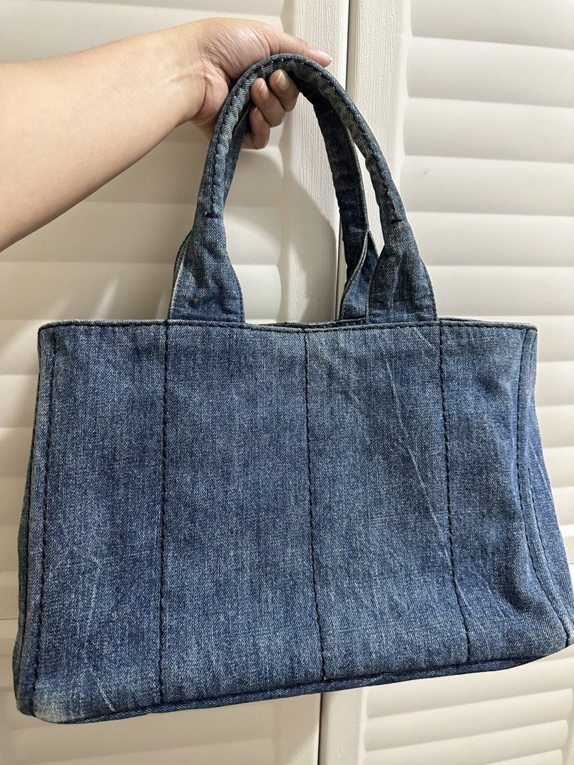 Original Prada Denim Tote Bag (Category: Luxury Bags & Wallets) located in Naga. Submitted by bag.net (Listing ID 1451473599, Image 2). Description: - Authentic Prada denim tote bag( Guaranteed original 💯 moneyback) - Classic design with iconic Prada logo - Spacious interior for essentials - Perfect for everyday use - Shows some minor signs of wear consistent with age but still stunning in actual.