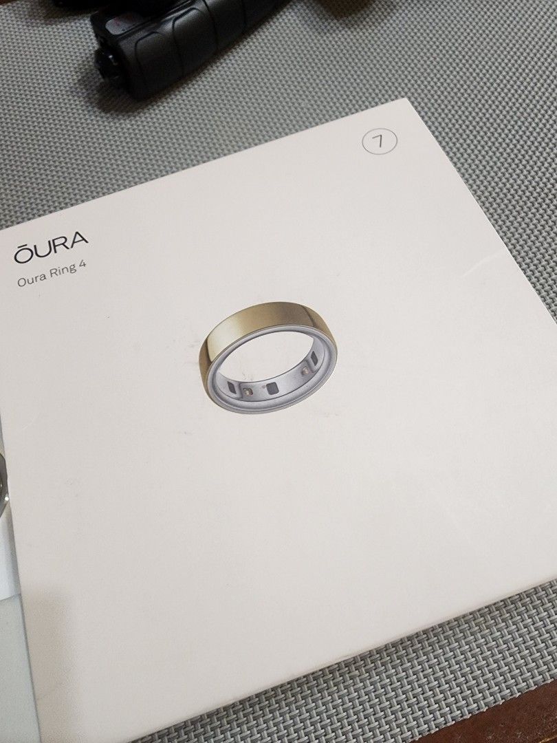 Oura Ring 4 Gold Smart Ring size 7 (Category: Other Gadgets) located in Manila. Submitted by mcbuy_sell (Listing ID 1451442789, Image 1). Description: - Oura Ring Gen 4 - Color: Gold - Tracks: Sleep, Activity, Readiness - Includes: Charger - Ideal for: Monitoring health, wellness, recovery, and performance insights.