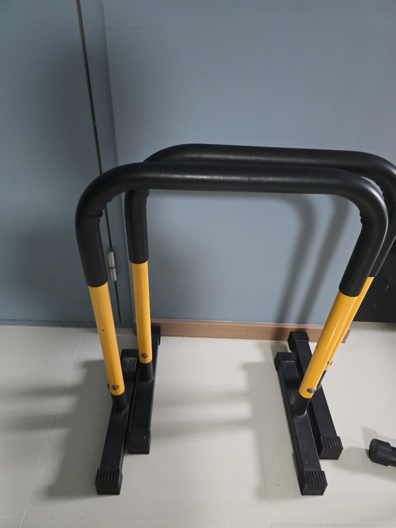 parallel bar (Category: Toning & Stretching Accessories) located in Singapore. Submitted by squirrelmama (Listing ID 1451412745, Image 1). Description: - Sturdy parallel bars for home fitness. - Durable black frame with comfortable yellow grip handles. - Ideal for bodyweight exercises like dips, push-ups, and core training. - Enhances your strength training routine. - not for fussy buyer as 1 corner is a bit worn - collection is at 430A bedok nor