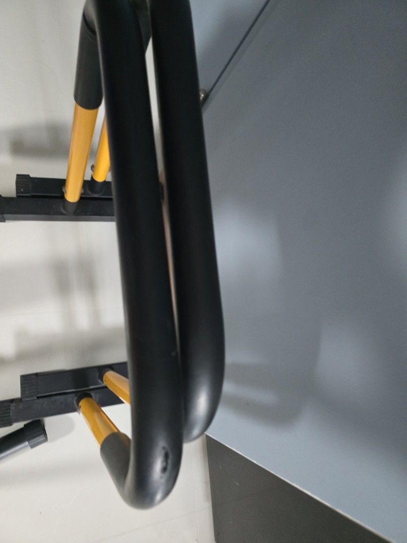 parallel bar (Category: Toning & Stretching Accessories) located in Singapore. Submitted by squirrelmama (Listing ID 1451412745, Image 2). Description: - Sturdy parallel bars for home fitness. - Durable black frame with comfortable yellow grip handles. - Ideal for bodyweight exercises like dips, push-ups, and core training. - Enhances your strength training routine. - not for fussy buyer as 1 corner is a bit worn - collection is at 430A bedok nor