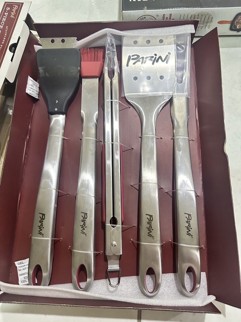 Parini Stainless Steel 5-Piece Grill Tool Set (Category: Cookware & Accessories) located in Quezon City. Submitted by faststone.ba186f (Listing ID 1451444305, Image 3). Description: - Parini 5-piece stainless steel grill tool set - Includes: tongs, spatula, fork, and basting brush - Essential for outdoor grilling perfection - Ergonomic soft grip handles for comfortable use - Hanging holes on each tool for convenient storage - Ideal for your next 