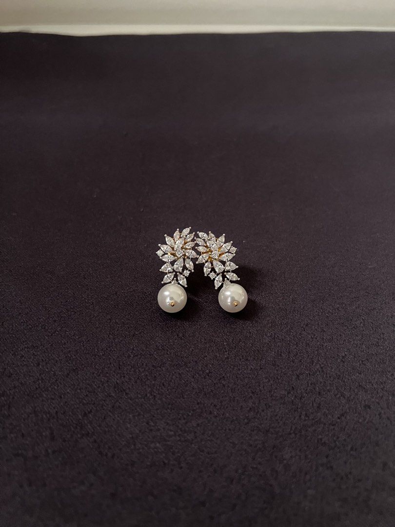 Pearl Drop Earrings with Crystal Flower Design (Category: Earrings) located in Makati City. Submitted by jcc999 (Listing ID 1451369074, Image 2). Description: - Beautiful pearl drop earrings - Features a crystal flower design at the top - Adds a touch of elegance to any outfit - Perfect for special occasions or everyday wear - Lightweight and comfortable ✨Follow @therarepieces.co in instagram for 10% pesos discount ✨More pieces to launch soon.