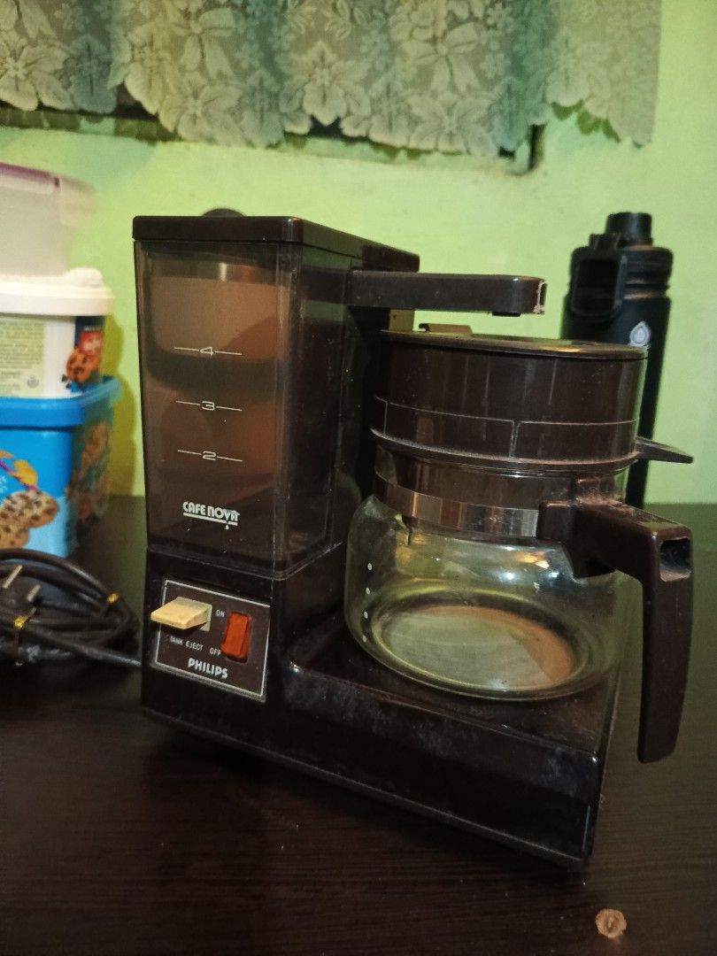 Philips Cafe Nova 5164 Drip Coffee Maker (Category: Coffee Machines & Makers) located in Marikina City. Submitted by voilree (Listing ID 1451431842, Image 2). Description: - Vintage Philips Cafe nova 5164 drip coffee maker - Black plastic body - Glass carafe included - Water level indicator on the side - Simple on/off switch - Power cord included - Ideal for making morning coffee.