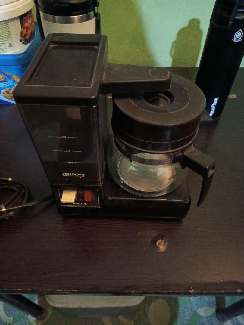 Philips Cafe Nova 5164 Drip Coffee Maker (Category: Coffee Machines & Makers) located in Marikina City. Submitted by voilree (Listing ID 1451431842, Image 1). Description: - Vintage Philips Cafe nova 5164 drip coffee maker - Black plastic body - Glass carafe included - Water level indicator on the side - Simple on/off switch - Power cord included - Ideal for making morning coffee.