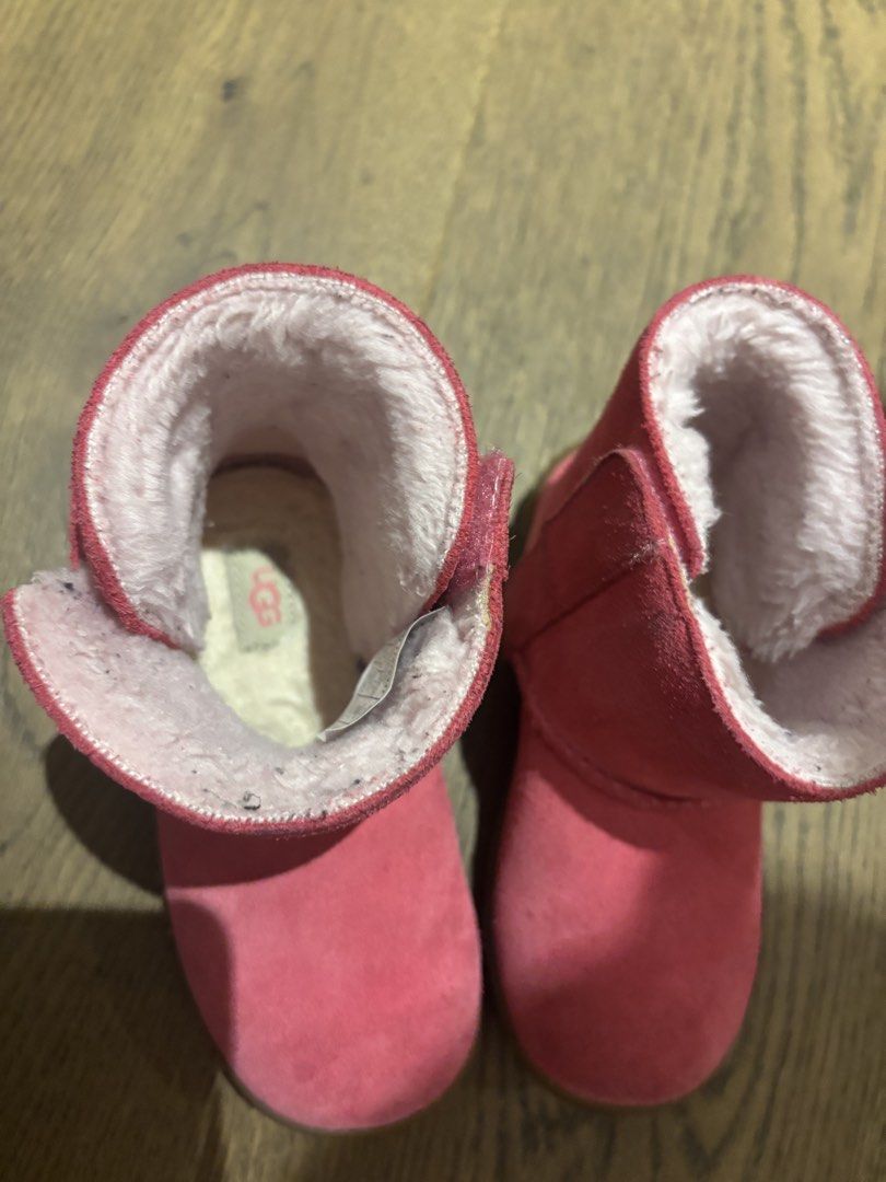 Pink UGG Boots with Fur Lining (Category: Boots) located in Manila. Submitted by migflo (Listing ID 1451420723, Image 2). Description: - Adorable pink UGG boots for kids - Cozy faux fur lining for warmth - Convenient velcro straps for easy on/off - Perfect for chilly weather.