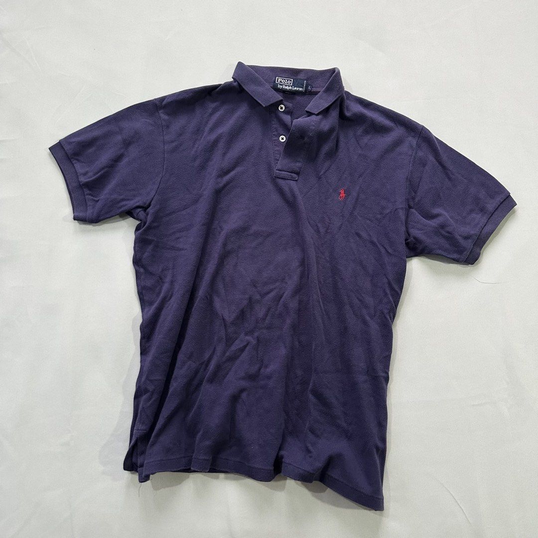 Polo Ralph Lauren Navy Blue Polo (Category: Tshirts & Polo Shirts ) located in Quezon City. Submitted by ys4bella (Listing ID 1451444996, Image 1). Description: - Classic navy blue Polo Ralph Lauren polo shirt - Features the iconic red pony logo - Size: Large (L) - Button-up collar - Versatile for casual wear or layering - Wardrobe essential.