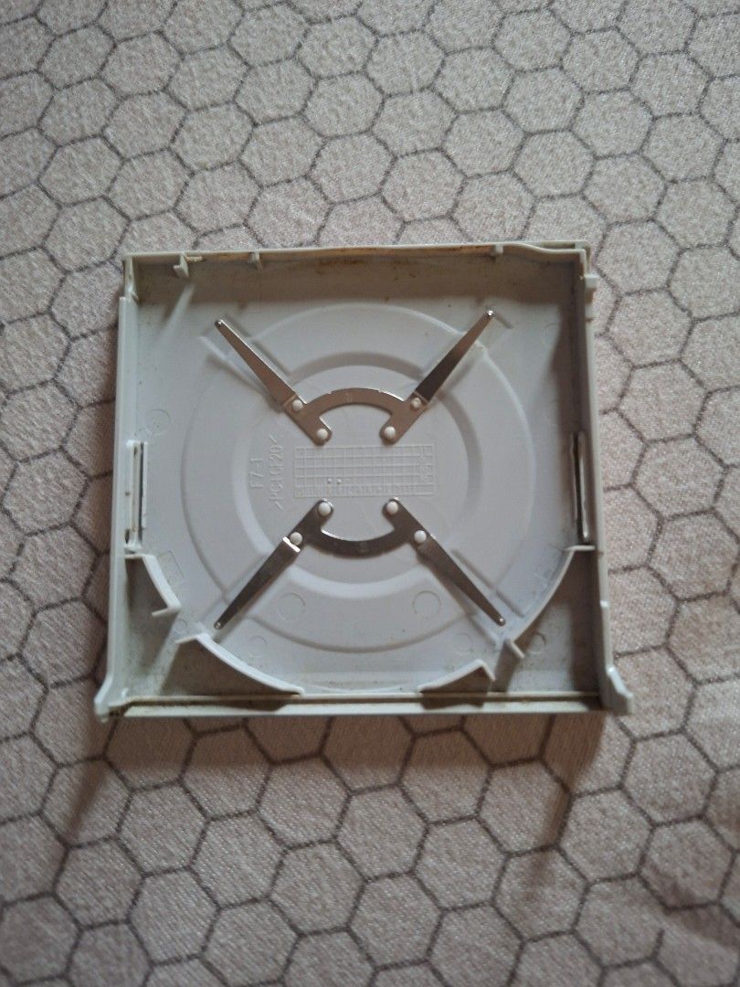 PSP Cover /Handheld Console (Category: PlayStation) located in Rizal. Submitted by carou66859 (Listing ID 1451345422, Image 2). Description: This is a Sony PSP-3000 handheld console. The selected region highlights the UMD (Universal Media Disc) drive door on the back. This specific unit appears to be the Mystic Silver color variant. -Price is 295 only Rizal area.Shipping sagot ng buyer..