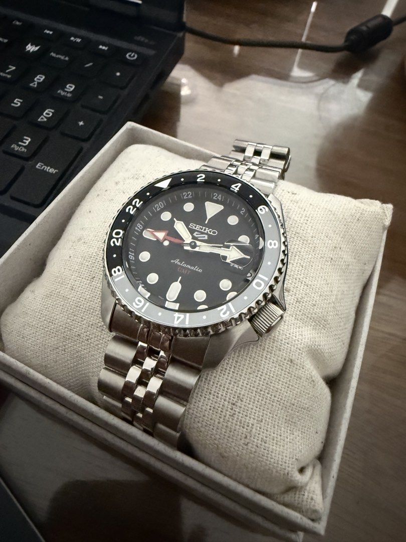 Seiko 5 Sports BRUCE WAYNE GMT Automatic Watch (Category: Men's Watches) located in Caloocan City. Submitted by jmarcusgarcia (Listing ID 1451408919, Image 2). Description: - Seiko 5 GMT Automatic Watch - Classic black dial - Durable stainless steel bracelet - Comes with original box - Includes warranty card - Ideal for travel and everyday wear - Used twice only - Feel free to ask questions!.
