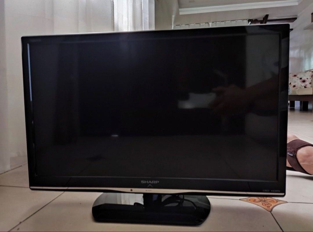 Sharp Aquos LC-24LE15M (Category: TV) located in Manila. Submitted by ra122120 (Listing ID 1451422575, Image 1). Description: - Sharp Aquos LED TV - Screen size (24 inches) - Includes original stand and remote - All ports accessible on the back - Tested and confirmed working - Ideal for gaming and watching movies/shows.