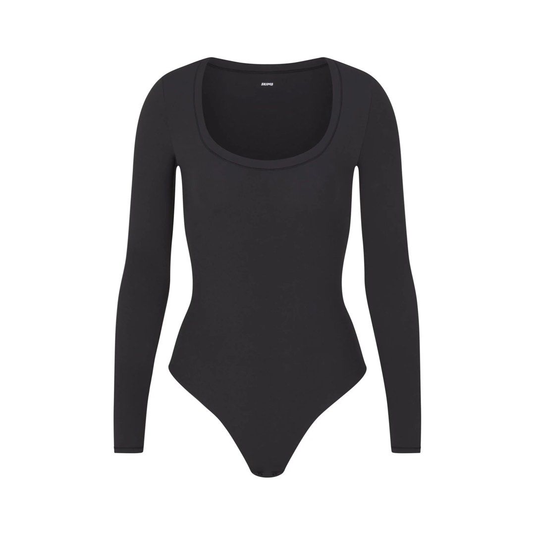 Skims longsleeve bodysuit (Category: Others Tops) located in Muntinlupa City. Submitted by _s0phia (Listing ID 1451446974, Image 3). Description: essential longsleeve scoop neck bodysuit onyx size: xxs/xs original price: 5000.