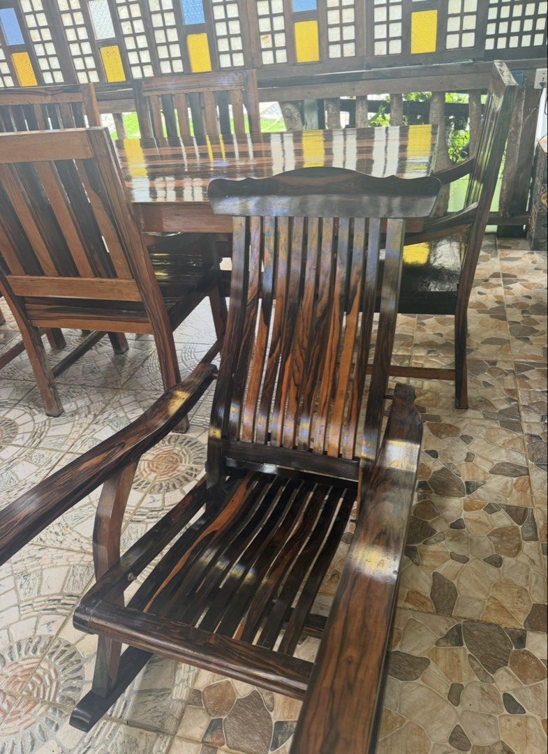 Solid Wood Dining Table and Chairs Set (Category: Tables & Sets) located in Pasig City. Submitted by silverrabbit_997049 (Listing ID 1451377650, Image 2). Description: - Beautiful solid wood dining set 12 seater - Includes large table and 6 chairs - Rich, dark wood finish with natural grain patterns - Comfortable and sturdy chairs - Perfect for family gatherings and entertaining guests - Ideal for dining room or patio.