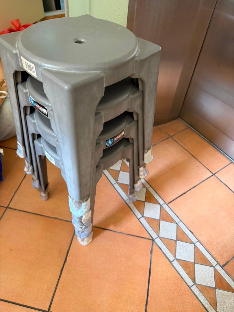 Stackable Plastic Stools (Category: Chairs) located in Singapore. Submitted by notsam (Listing ID 1451397748, Image 2). Description: - Set of 4 grey plastic stools - Brand: MAXIMA - Stackable design for space-saving - Sturdy and functional - Ideal for extra seating Each is $4 .