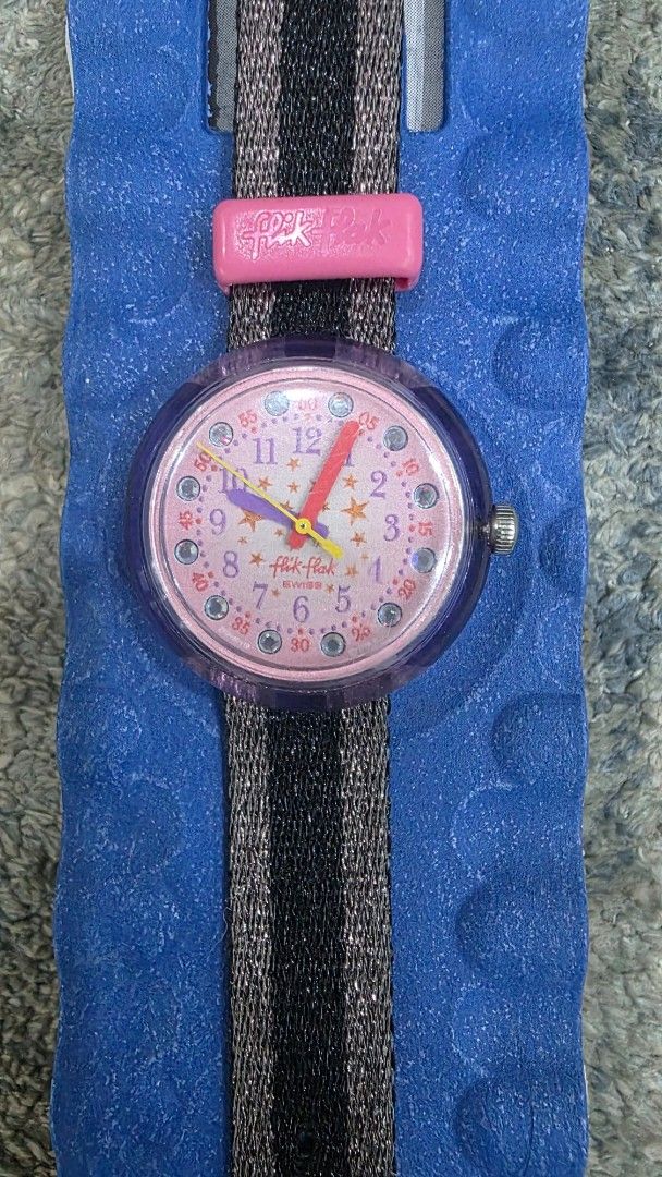 Swatch Watch - Pink Face, Storybook Theme (Category: Women's Watches) located in Manila. Submitted by chikawa3 (Listing ID 1451338606, Image 3). Description: This is a Flik Flak "Stary Way" (model FPNP119) children's watch. The watch has a quartz movement and is water-resistant up to 30 meters. - the strap is already change but you can buy a new one sa Swatch - Includes original packaging.