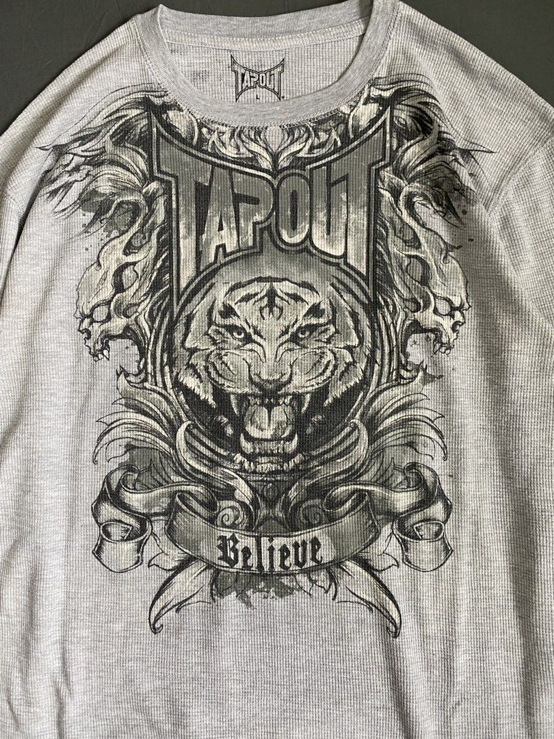 Tapout Tiger Y2k Waffle Grey Long Sleeve (Category: Tshirts & Polo Shirts ) located in Dagupan City. Submitted by georgy. (Listing ID 1451404099, Image 2). Description: Tapout Tiger Y2k Waffle Grey Long Sleeve ‎ ‎width: 21” (L) ‎length: 28.2” ‎color rate: 10/10 ‎flaws: pen ink stain on the back (still removable), penhole on the right sleeve, minor yellow stains ‎condition: 9/10 ‎ ‎Price: 1199 php ‎+ shipping fee ‎ ‎☆ Kindly read the rules on my p
