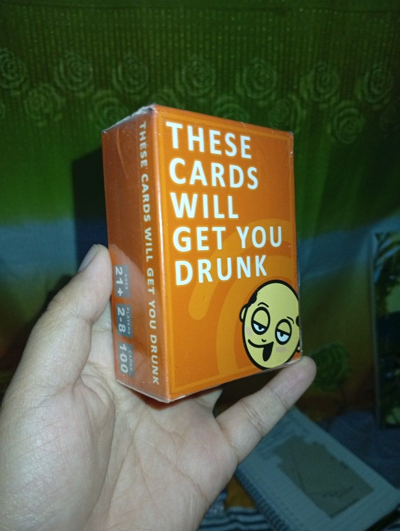 THESE CARDS WILL GET YOU DRUNK Card Game (Category: Board Games & Puzzles) located in La Trinidad. Submitted by cla.rissa317 (Listing ID 1451440982, Image 2). Description: - Fun card game perfect for parties! - Simple rules: Draw cards and follow instructions to determine who drinks. - Features competition, voting, and 'screw your friends over' mechanics. - Guaranteed to bring laughs and happy drinking! - Recommended for ages 21+. - Suitable for 