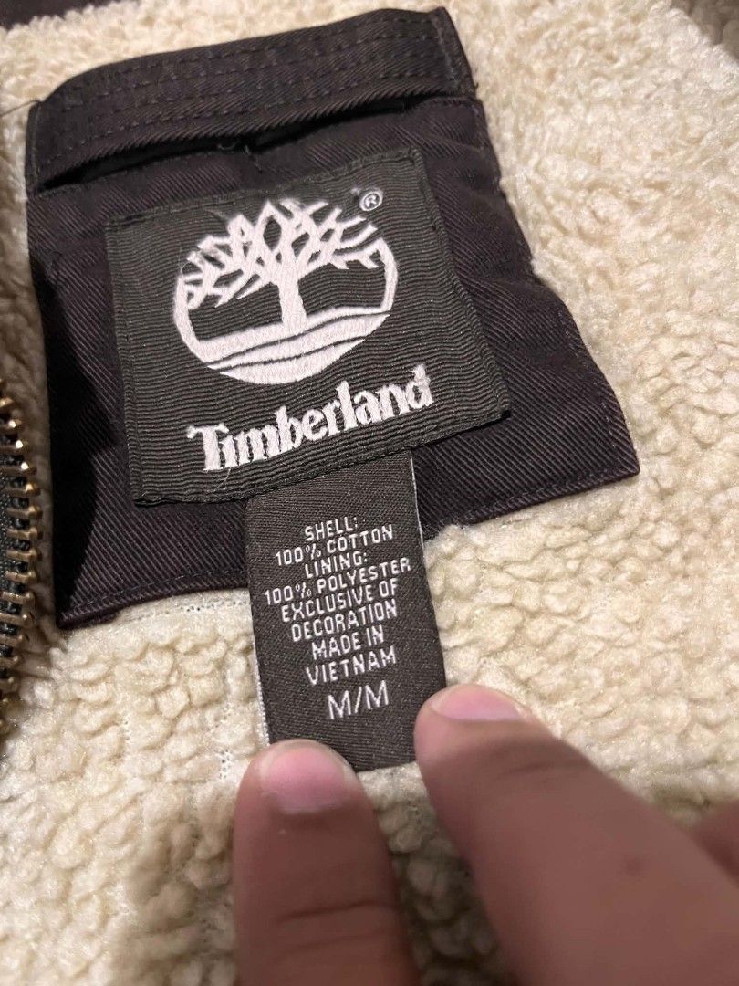 Timberland Brown Sherpa Lined Cotton Jacket M/M (Category: Coats, Jackets and Outerwear) located in Manila. Submitted by _lemornosnas02 (Listing ID 1451334776, Image 3). Description: - Brand: Timberland - Size: Medium (M) - Material: 100% Cotton Shell - Lining: 100% Polyester Sherpa for extra warmth - Closure: Zipper with two button flap chest pockets - Origin: Made in Vietnam.